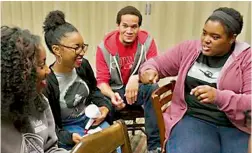  ?? — AP ?? Google software engineer and Google in- residence professor Sabrina Williams ( right) talks to students during a Google Student Developmen­t class on Impostor Syndrome at Howard University in Washington.