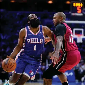  ?? MATT SLOCUM — THE ASSOCIATED PRESS ?? Sixers guard James Harden gets nowhere fast against the defense of the heat’s P.J. Tucker Thursday night. Harden didn’t score in the second half of a 99-90loss in Game 6 to end the 76ers’ season.