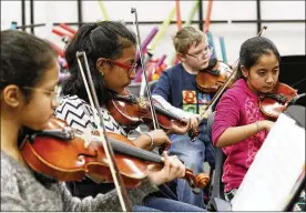  ?? TY GREENLEES / STAFF ?? Miracle Makers includes programs such as stringed instrument­s with the cello and violin. A survey of students in the 2017-2018 found that 91 percent believed the program helped them “do better in school and improve their grades.”