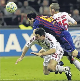  ?? Picture: PA. ?? Lionel Messi tangles with Djamel Mesbah and Daniele Bonera.