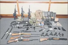  ?? U.S. District Court via Associated Press ?? This image provided by the U.S. District Court in Maryland shows a cache of firearms and ammunition that was in the motion for detention pending trial in the case against Christophe­r Paul Hasson, a Coast Guard lieutenant.