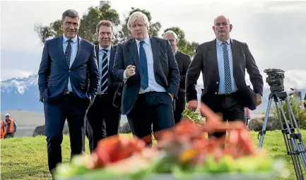  ??  ?? British Foreign Secretary Boris Johnson ready to try the local crayfish in Kaikoura yesterday.