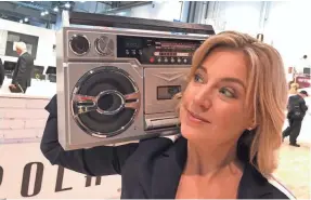  ?? NATHAN JONGEWAARD ?? Jennifer Jolly rocks out with a Victrola boom box on the showroom floor at CES 2019.