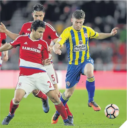  ??  ?? Shay McCartan, right, tries to escape the attentions of Boro defender Fabio Da Silva. STEWART DOWNING has struggled for game time this season, but provided Aitor Karanka with a timely reminder of his abilities with an assured display and a cracking...