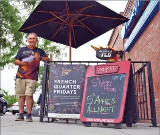  ?? STEVE MacNAULL/The Okanagan Weekend ?? The Grateful Fed owner Kamel Abougoush holds three infraction notices the City of Kelowna says could lead to the shutdown of his restaurant’s patio.