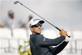  ?? WILFREDO LEE ASSOCIATED PRESS FILE PHOTO ?? Adam Scott tees off last week during the Honda Classic golf tournament in Palm Beach Gardens, Fla. Scott will skip the Dell Match Play in Austin, Texas.