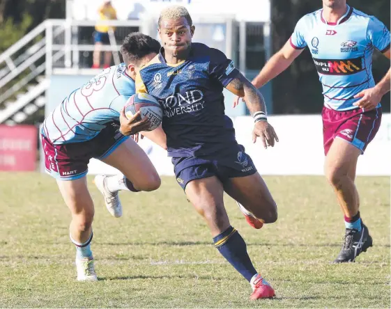  ?? Picture: RICHARD GOSLING ?? Gus Qasevakati­ni makes a charge for Bond in their emphatic victory over Norths.