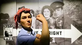  ?? Bob Donaldson/Post-Gazette ?? A life-size replica of Rosie the Riveter from the “We Can Do It!” poster greets visitors at the Heinz History Center’s exhibit. In Sunday’s Next Page read how a Pittsburgh artist created that poster.