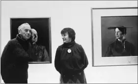  ?? ANONYMOUS ?? In this May 1985file photo, American artist Andrew Wyeth poses with his wife Betsy at an unknown location in front of his paintings “The Patriot,” left, and “Maga’s Daughter” for which Betsy was the model. Betsy James Wyeth, the widow, business manager and muse of painter Andrew Wyeth, died Tuesday, April 21, 2020, at age 98, according to the Brandywine River Museum of Art in Chadds Ford, Pa., which she helped found.
