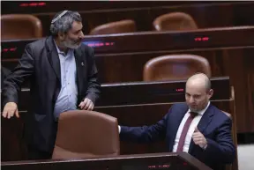  ?? (Yonatan Sindel/Flash90) ?? BAYIT YEHUDI MK Naftali Bennett gives the thumbs-up sign during the vote on the settlement­s regulation bill in the Knesset in Jerusalem Monday night.