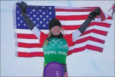  ?? Associated Press ?? Jacobellis takes gold: United States' Lindsey Jacobellis celebrates after winning a gold medal in the women's cross finals at the 2022 Winter Olympics Wednesday in Zhangjiako­u, China.