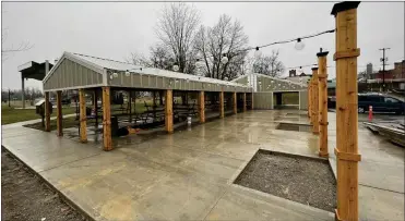  ?? ?? The Shelby Community Improvemen­t Corporatio­n posted this photo of the pergola structure downtown coming along nicely despite the rainy weather on their Facebook page
Photo by the Shelby CIC