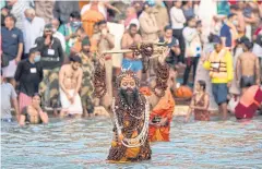  ?? AFP ?? A devotee bathes in the Ganges river during the religious Kumbh Mela festival, in Haridwar on Monday.