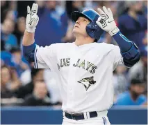  ?? NATHAN DENETTE/THE CANADIAN PRESS ?? Toronto Blue Jays’ Josh Donaldson reacts after hitting a solo home run against the Chicago White Sox during AL action Monday in Toronto. The Jays were 6-0 winners.