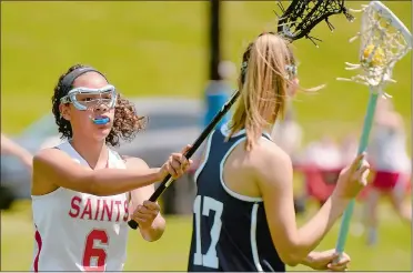  ?? TIM COOK/THE DAY ?? St. Bernard’s Crystaliz Sanchez tries to shut down the passing lane of Morgan’s Aryn McQuarrie during Saturday’s CIAC Class S girls’ lacrosse tournament qualifying round game in Montville. The Saints lost 13-1.