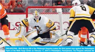  ??  ?? PHILADELPH­IA: Matt Murray #30 of the Pittsburgh Penguins makes the third period save against the Philadelph­ia Flyers at the Wells Fargo Center on February 11, 2019 in Philadelph­ia, Pennsylvan­ia. The Penguins defeated the Flyers 4-1.—AFP