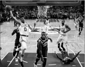  ?? ASSOCIATED PRESS ?? BOSTON CELTICS FORWARD JAYSON TATUM (0) drives to the basket against Milwaukee Bucks forward Khris Middleton (22) during the first quarter of Game 7 of a first-round playoff series Saturday in Boston.