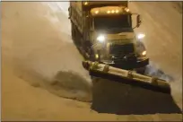  ?? MEDIANEWS GROUP ?? A PennDOT plow works on the Mohnton interchang­e to Route 222 northbound in Cumru Township after a 2014 storm.