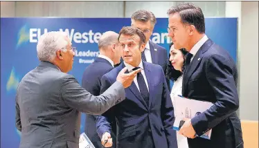  ?? AFP ?? Portuguese Premier Antonio Costa (left), Dutch counterpar­t Mark Rutte (right) and French President Emmanuel Macron in Brussels.