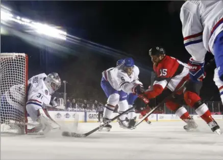  ?? DAVE SANDFORD, GETTY IMAGES ?? Zack Smith (15) of the Senators battles for a loose puck with Montreal Canadiens goaltender Carey Price and defenceman Shea Weber on Saturday night at the Scotiabank NHL 100 Classic at Lansdowne Park in Ottawa.