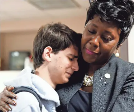  ??  ?? Rep. Patricia Williams, D-Fort Lauderdale, right, hugs Parkland student Daniel Bishop, 16. HALI TAUXE/USA TODAY NETWORK