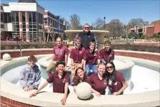  ?? Special to The Saline Courier ?? The Benton High School Quiz Bowl team poses for a picture in the fountain at the University of Arkansas of Fort Smith where the 6A State Tournament was held. The team finished in second place at state and first place at regionals.