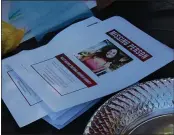  ??  ?? A stack of missing person fliers for Oroville woman Tatiana Dugger sit on a table during a downtown walk Saturday.