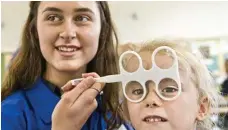  ??  ?? Destiny McLoughlin races through her sight test when checked by fifth-year optometry student Carmen Senescal.