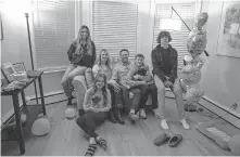  ??  ?? Jessica and Jason Jaffrey sit with their children at home Jan. 11 in Oak Park, Illinois. The children from left are: Maya Cherikos, 15, Delaney Cherikos, 12, Connor Jaffrey, 10, and Matthew Jaffrey, 14. The couple eloped via Zoom on New Year's Eve after the pandemic canceled their wedding plans. [ERIN HOOLEY/CHICAGO TRIBUNE/ TNS]