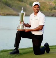  ?? AFP ?? Chawrasia poses with the trophy. —