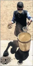  ??  ?? Chantel Mokgohloa, 11, filters the clay before working on it.