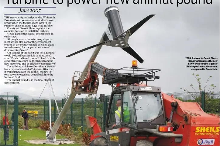  ??  ?? 2005: Andrew McCourt, Shiels Constructi­on gives the new 2.5KW wind turbine a gentle lift into position at the animal compound in Dromiskin.