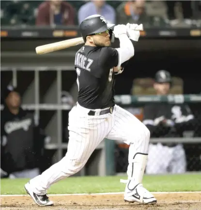 ?? AP ?? Yolmer Sanchez ( 3- for- 5) hits a RBI single in the eighth inning Tuesday against the Orioles at Guaranteed Rate Field.