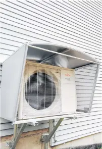  ?? COVER-TECH PHOTO ?? This air-source heat pump delivers 2x to 3x more heat than the electricit­y it takes to operate. A unit like this can also function as an air conditione­r during hot weather.