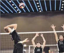  ?? Hans Pennink / Special to the Times Union ?? Burnt Hills’ Jake Baker, left, goes for a spike against Bellmore JFK in the Div. II state championsh­ip match. Staff reports