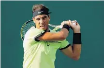  ?? MATTHEW STOCKMAN/GETTY IMAGES ?? Rafael Nadal returns a shot to Dudi Sela during the Miami Open at Crandon Park Tennis Center on Friday.