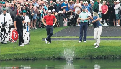  ?? Picture: Reuters ?? TRICK SHOT. World No 1 Dustin Johnson skips a ball off the water on the 16th hole during a practice round for the 2017 Masters at Augusta.