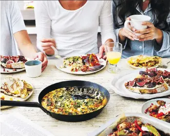  ?? KRIS KIRKHAM/WELDON OWEN ?? Include at least one sweet and one savoury dish to make a brunch guests will rave about, such as Cheddar and Feta Frittata, in skillet, paired with Caramelize­d Banana Crepes, left of skillet.