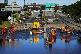  ?? MATT ROURKE — THE ASSOCIATED PRESS ?? Workers pump water from a flooded section of Interstate 676in Philadelph­ia Sept. 3in the aftermath of downpours and high winds from the remnants of Hurricane Ida that hit the area. The cleanup and mourning has continued as the Northeast U.S. recovers from record-breaking rainfall from the remnants of Hurricane Ida.