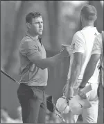  ?? Associated Press ?? Koepka shares lead: Brooks Koepka, left, shakes hands with Dustin Johnson after they completed the second round of the Northern Trust PGA golf tournament Friday at Ridgewood Country Club in Paramus, N.J.