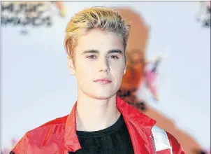  ?? AP PHOTO ?? In this November 2015 file photo, Justin Bieber arrives at the Cannes festival palace in Cannes, southeaste­rn France. He didn’t specifical­ly say sorry, but Bieber has finally given his fans an explanatio­n of why he decided to suddenly back out of his...