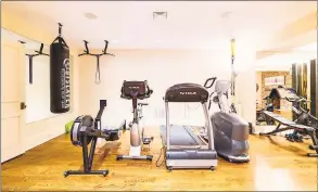  ?? Kyle P. Norton / Contribute­d photo ?? A lower-level in-home gym is just one of many amenities at 601 Lake Ave., Greenwich, currently listed for $7.75 million by Berkshire Hathaway Home Services’ Greenwich brokerage.