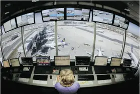  ?? THOMAS LOHNES/AFP/Gett y Images ?? American air traffic controller­s are allowed to work schedules known as “rattlers” that cram five work shifts into four 24-hour periods.
