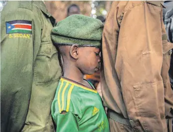  ?? FOTO: AFP ?? Auch im Südsudan müssen Kinder als Soldaten kämpfen.