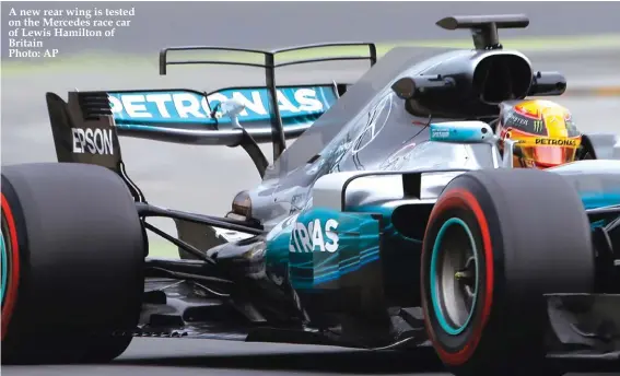  ??  ?? A new rear wing is tested on the Mercedes race car of Lewis Hamilton of Britain Photo: AP