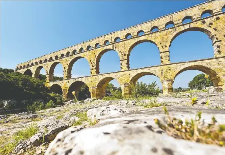  ?? DOMINIC ARIZONA BONUCCELLI ?? The city of Nîmes relied on a long aqueduct, which includes the still-impressive Pont du Gard, for its water supply.