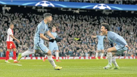  ?? EPA ?? Manchester City’s Sergio Aguero, left, celebrates with Leroy Sane after scoring against Monaco.