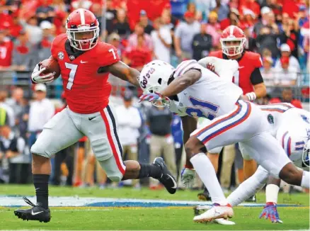  ?? GEORGIA PHOTO/KRISTIN BRADSHAW ?? Georgia sophomore running back D’Andre Swift heads into this week’s home game against Auburn coming off the first two 100-yard games of his college career. He and junior Elijah Holyfield helped lead the Bulldogs to an SEC East title-clinching win at Kentucky last Saturday.