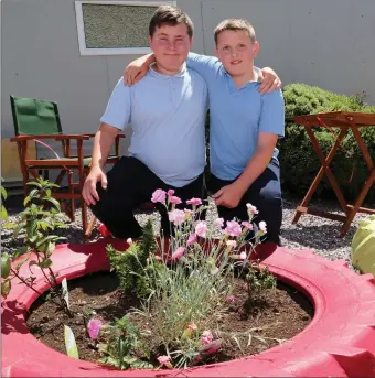  ??  ?? 6th Class pupils Paudie McCarthy and Ronan Curtin officially opened the Sensory Garden at Meelin National School. Photos by Sheila Fitzgerald.