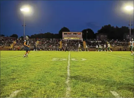  ?? AUSTIN HERTZOG — DIGITAL FIRST MEDIA ?? Pottstown hosted Friday night football under the lights for the first time since 2013 Friday night when the Trojans faced Bishop Shanahan.